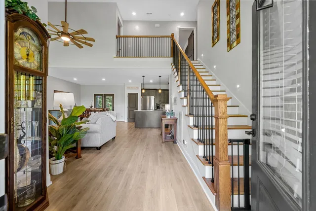 a living room with furniture fireplace and flat screen tv