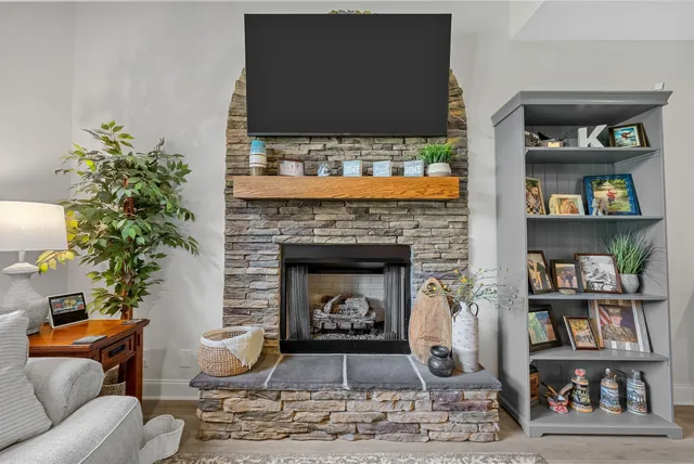 a living room with furniture and a fireplace