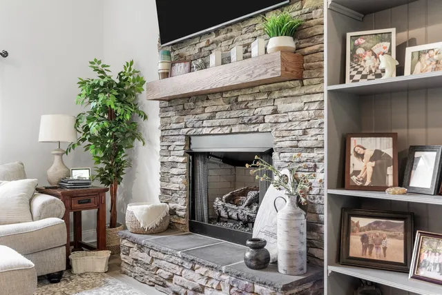 a living room with furniture and a dining table with kitchen view
