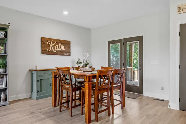 a bathroom with a sink mirror and toilet