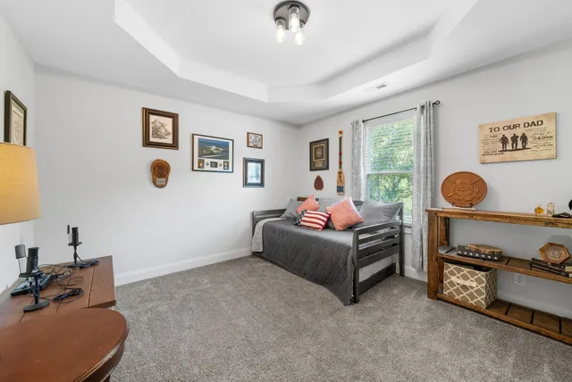a bathroom with a shower sink and mirror