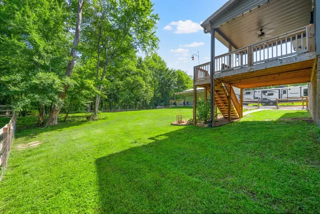 a picture of a kitchen with refrigerator and cabinet