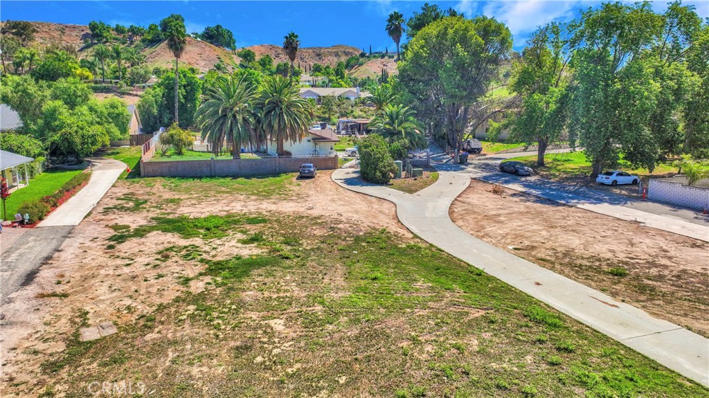 11553 Reche Canyon Road Colton, CA 92324 - Photo 12 of 13 a palm tree sitting in front of a house with a big yard
