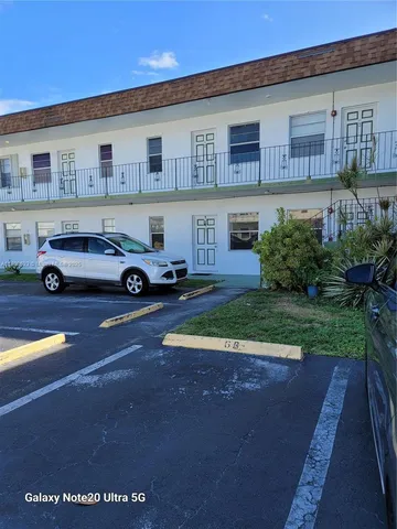 a car parked in front of a house