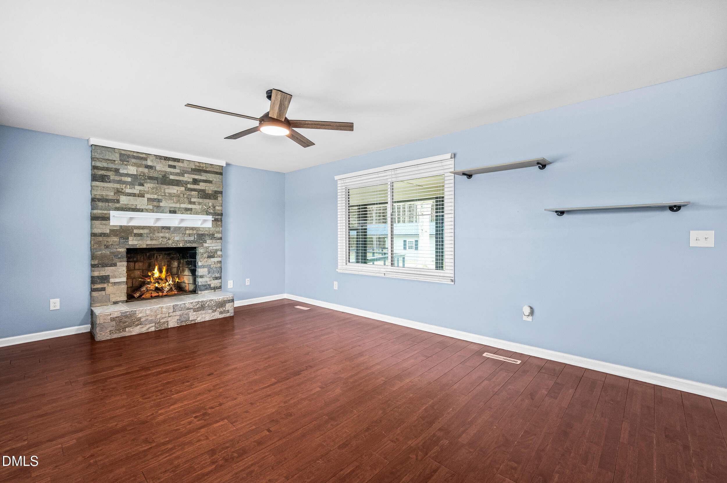 1896 Old Rte 22 Kenly, NC 27542 - Photo 12 of 32 wooden floor fireplace and windows in an empty room