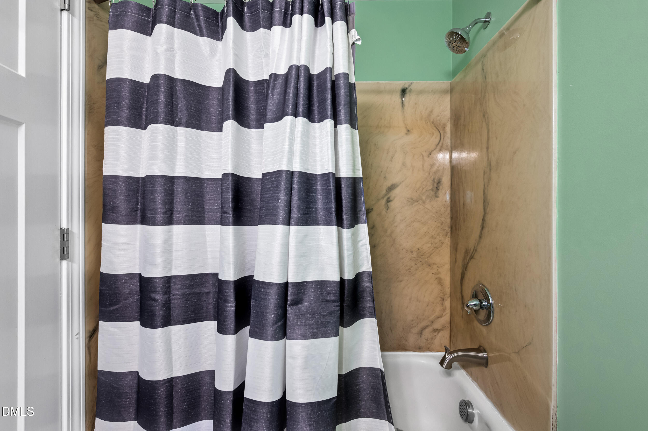 1896 Old Rte 22 Kenly, NC 27542 - Photo 16 of 32 a bathroom with a sink and a shower curtain