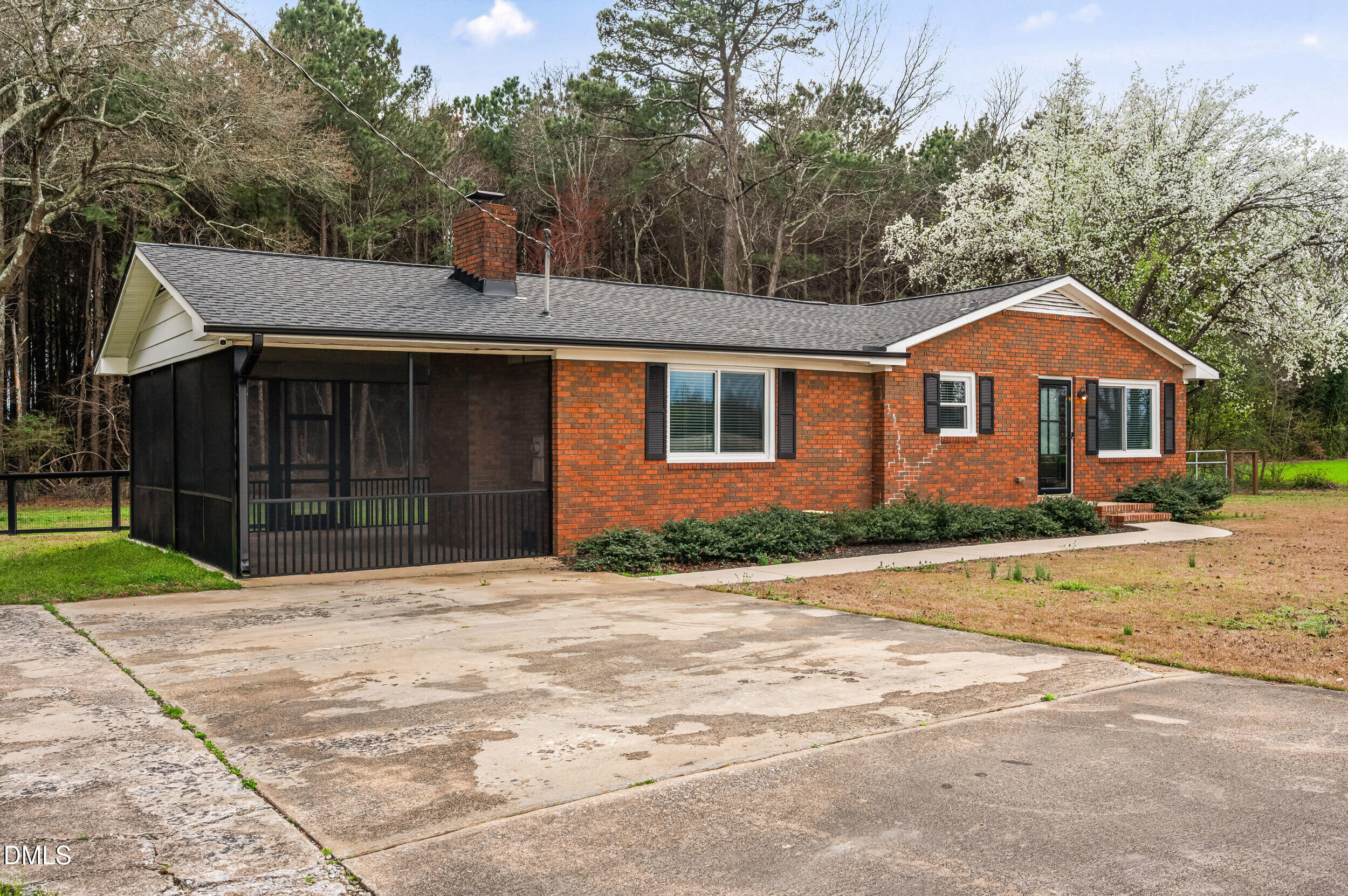 1896 Old Rte 22 Kenly, NC 27542 - Photo 2 of 32 a front view of a house with a yard and garage