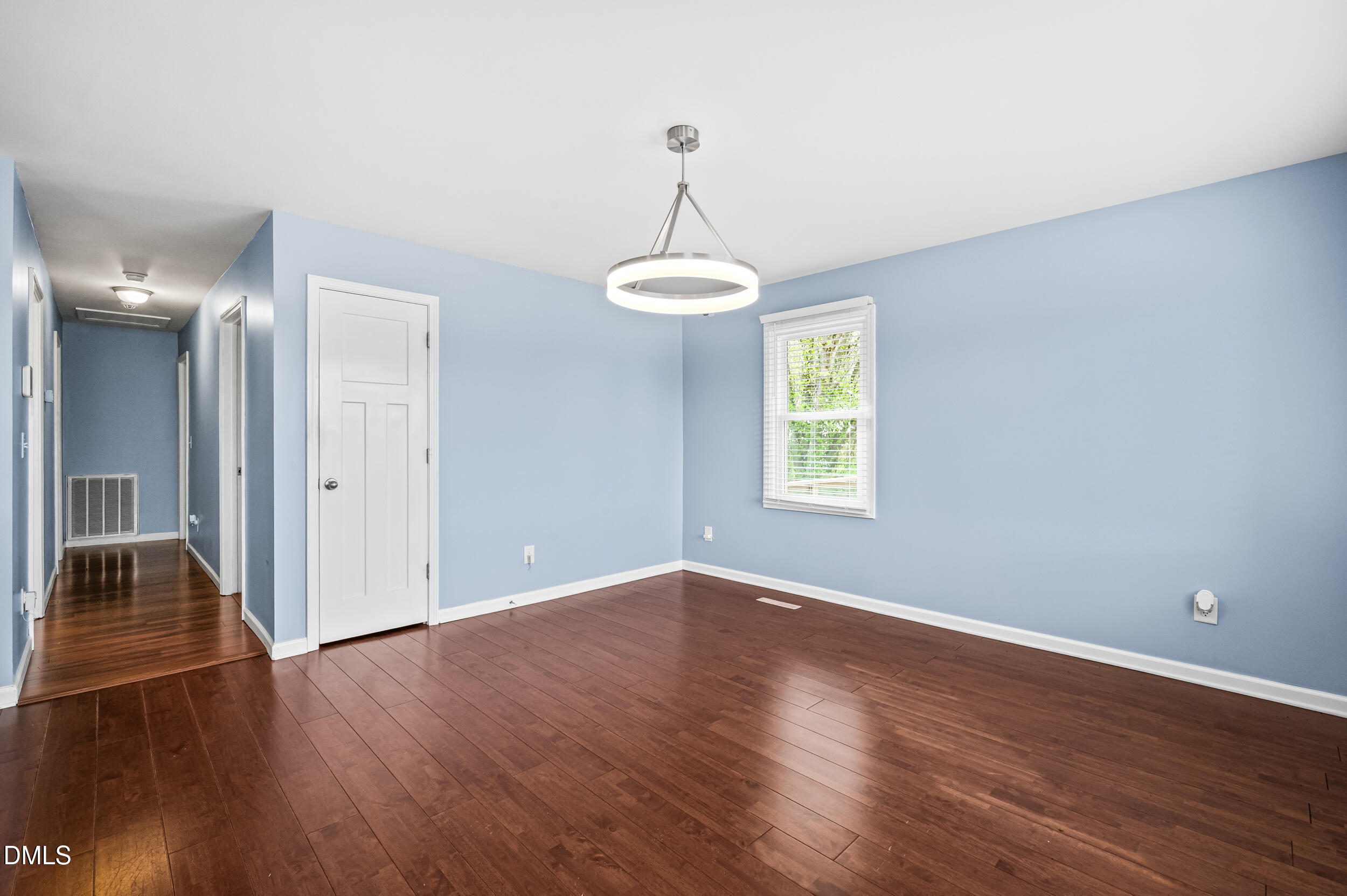 1896 Old Rte 22 Kenly, NC 27542 - Photo 4 of 32 a view of a room with wooden floor ceiling fan and windows