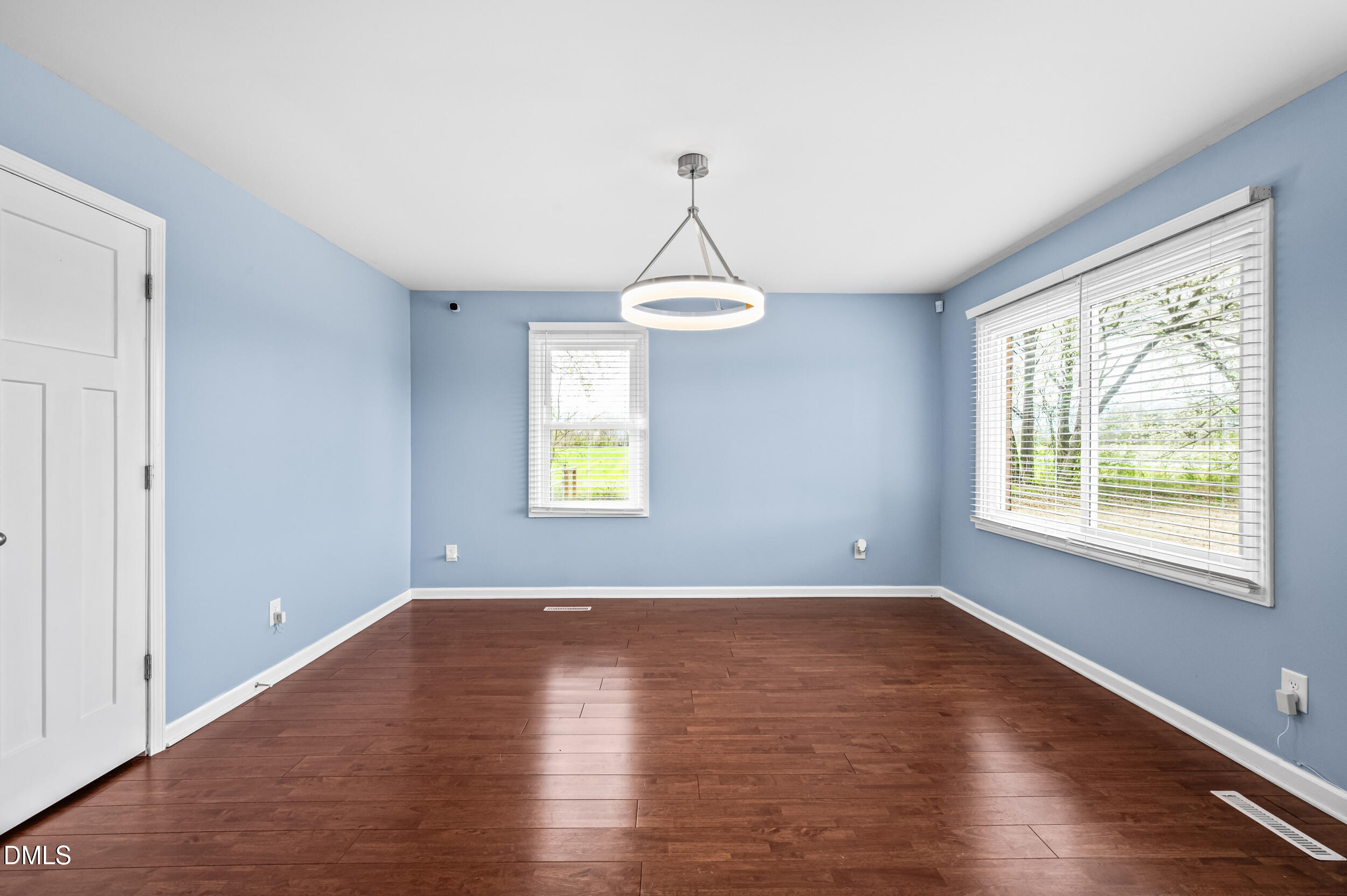 1896 Old Rte 22 Kenly, NC 27542 - Photo 5 of 32 an empty room with wooden floor and windows