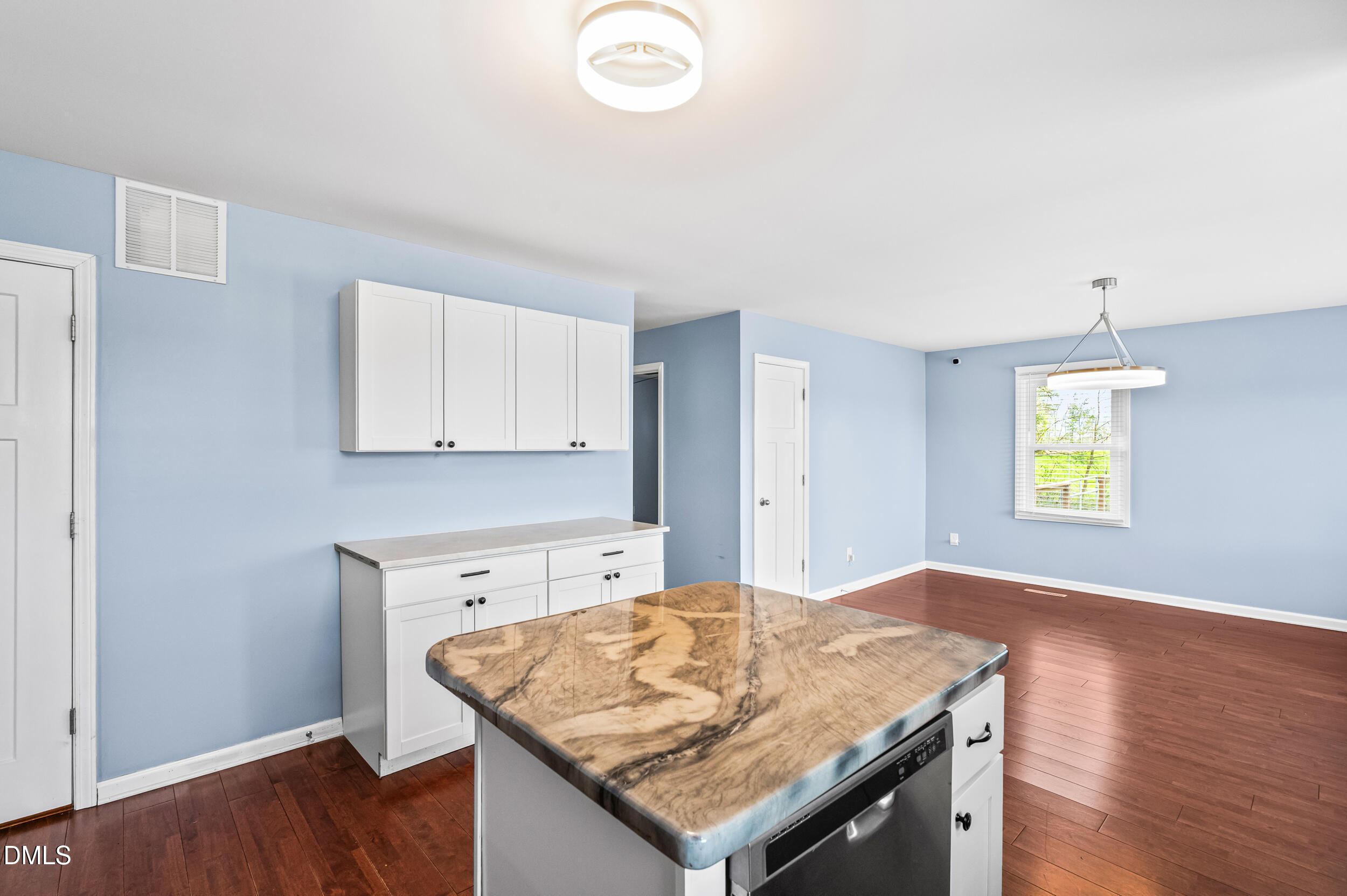 1896 Old Rte 22 Kenly, NC 27542 - Photo 9 of 32 a kitchen with granite countertop a stove a sink and a microwave