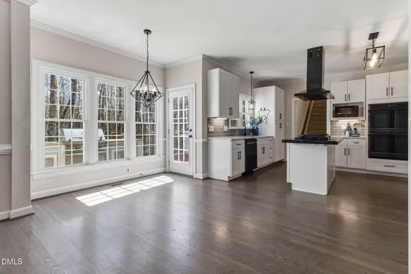 wooden floor in an empty room with a fireplace