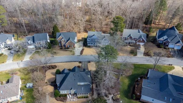 an aerial view of a house with a yard