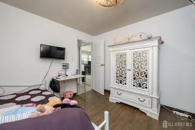 a room with furniture and flat screen tv