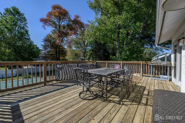 a view of balcony with wooden floor and seating space