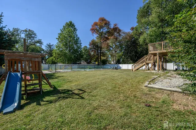 a view of playground with a slide and swing