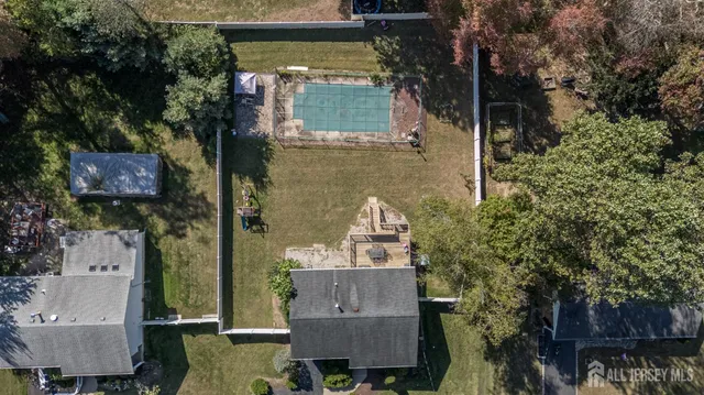 an aerial view of a house with outdoor space
