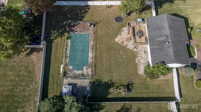 an aerial view of a residential houses with outdoor space