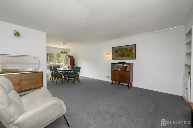 a living room with furniture and a piano