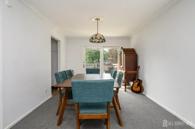 a dining room with furniture window and outside view