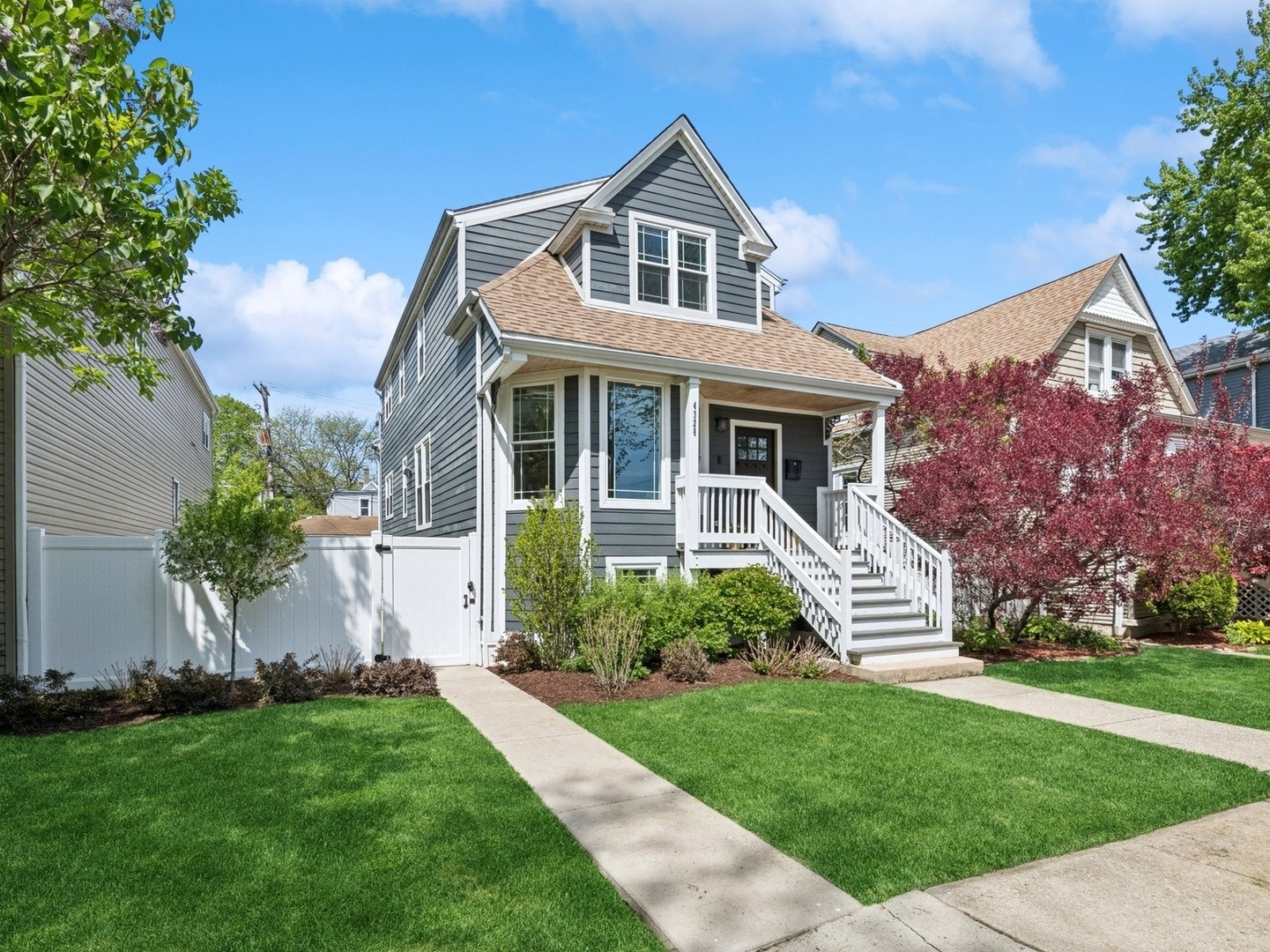 front view of a house with a yard