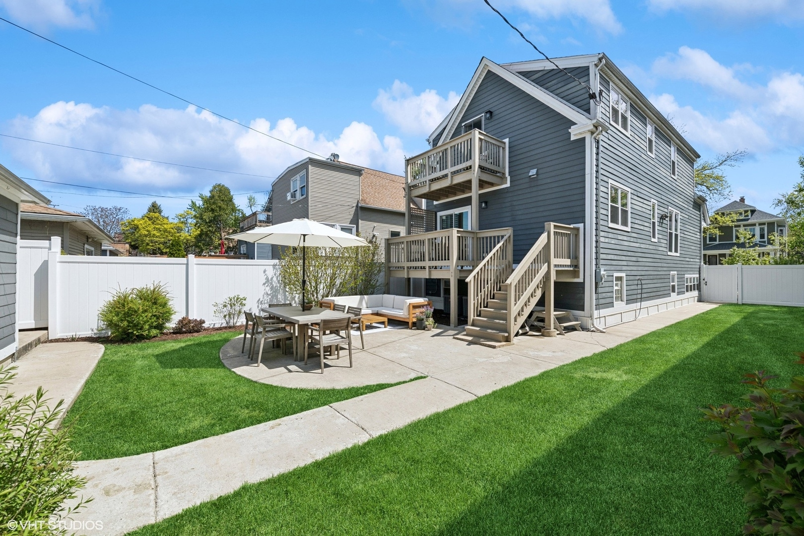 4328 North Ridgeway Avenue Chicago, IL 60618 - Photo 31 of 32 a view of a house with backyard sitting area and garden