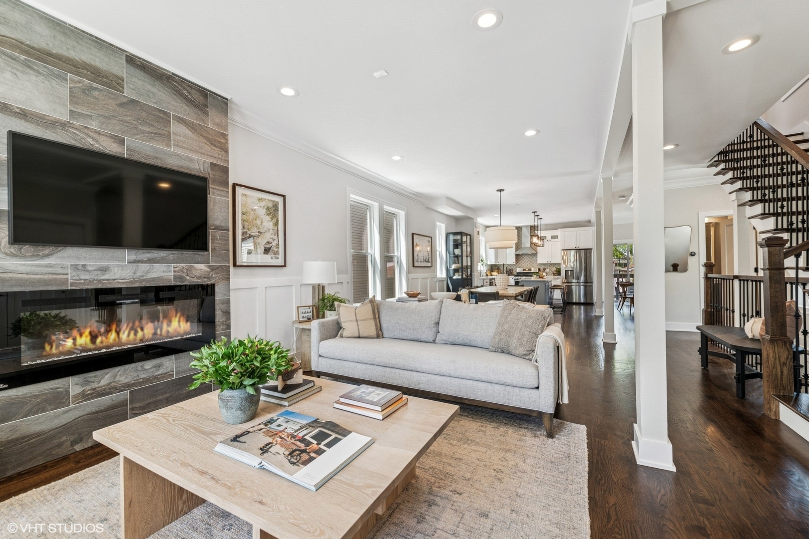 4328 North Ridgeway Avenue Chicago, IL 60618 - Photo 4 of 32 a living room with furniture a flat screen tv and a fireplace