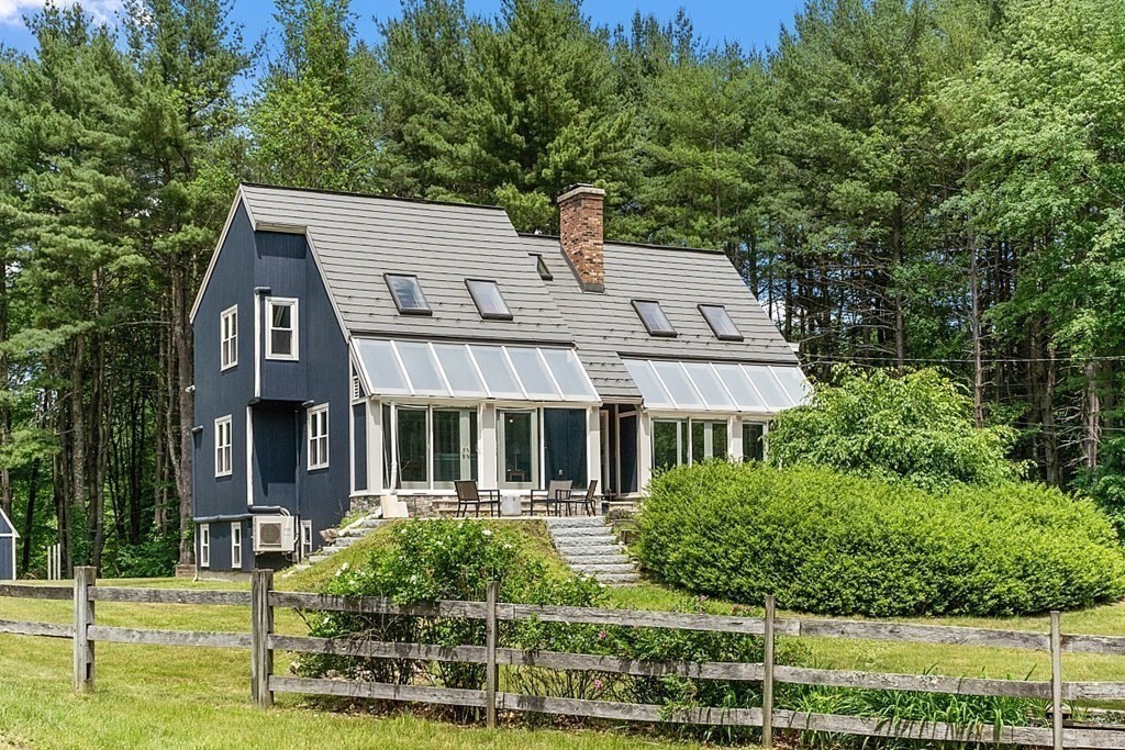 92 Sampson Road Bolton, MA 01740 - Photo 1 of 42 a front view of a house with a yard