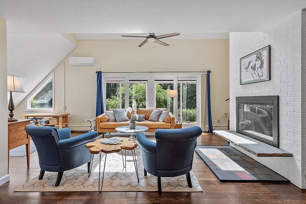 92 Sampson Road Bolton, MA 01740 - Photo 13 of 42 a living room with furniture and a fireplace