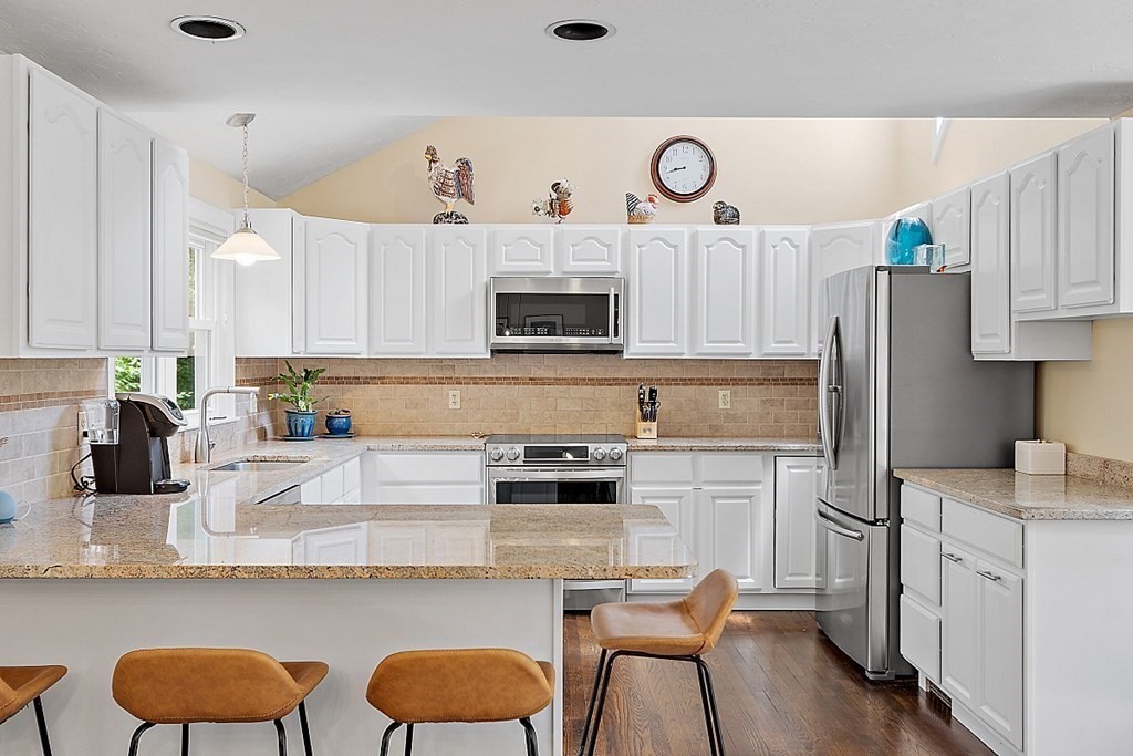 92 Sampson Road Bolton, MA 01740 - Photo 14 of 42 a kitchen with appliances a sink and cabinets
