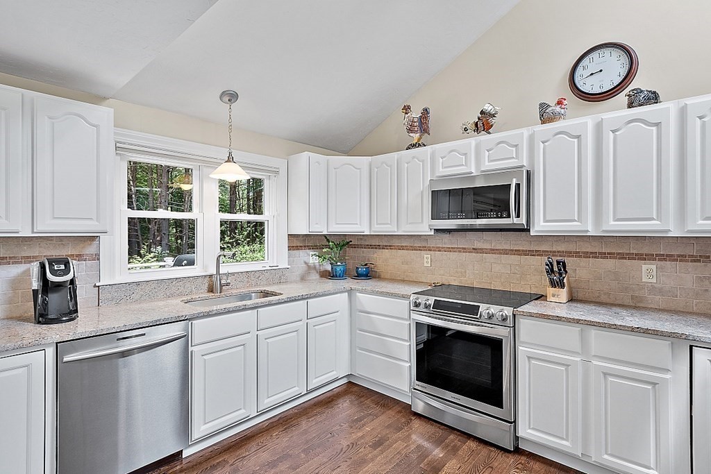 92 Sampson Road Bolton, MA 01740 - Photo 18 of 42 a kitchen with cabinets a sink and a stove top oven