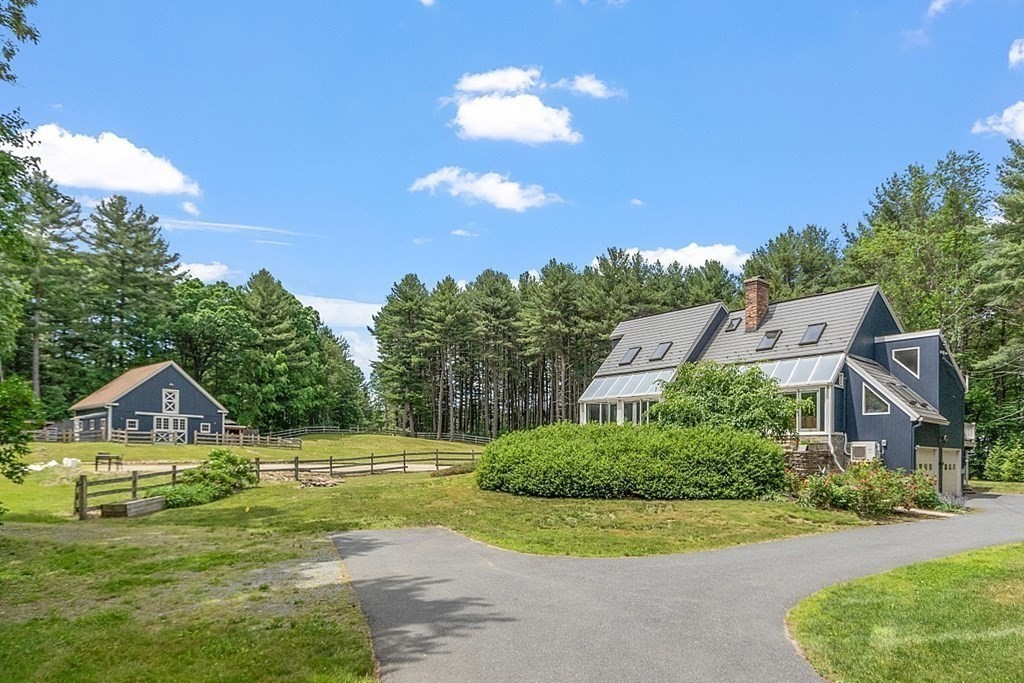 92 Sampson Road Bolton, MA 01740 - Photo 2 of 42 a aerial view of a house