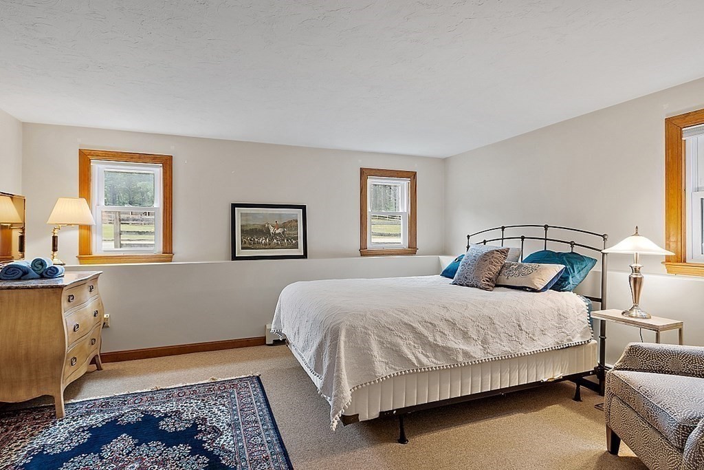 92 Sampson Road Bolton, MA 01740 - Photo 28 of 42 a bedroom with a bed and window