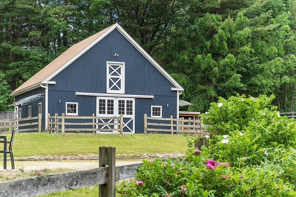 92 Sampson Road Bolton, MA 01740 - Photo 32 of 42 a front view of a house with garden