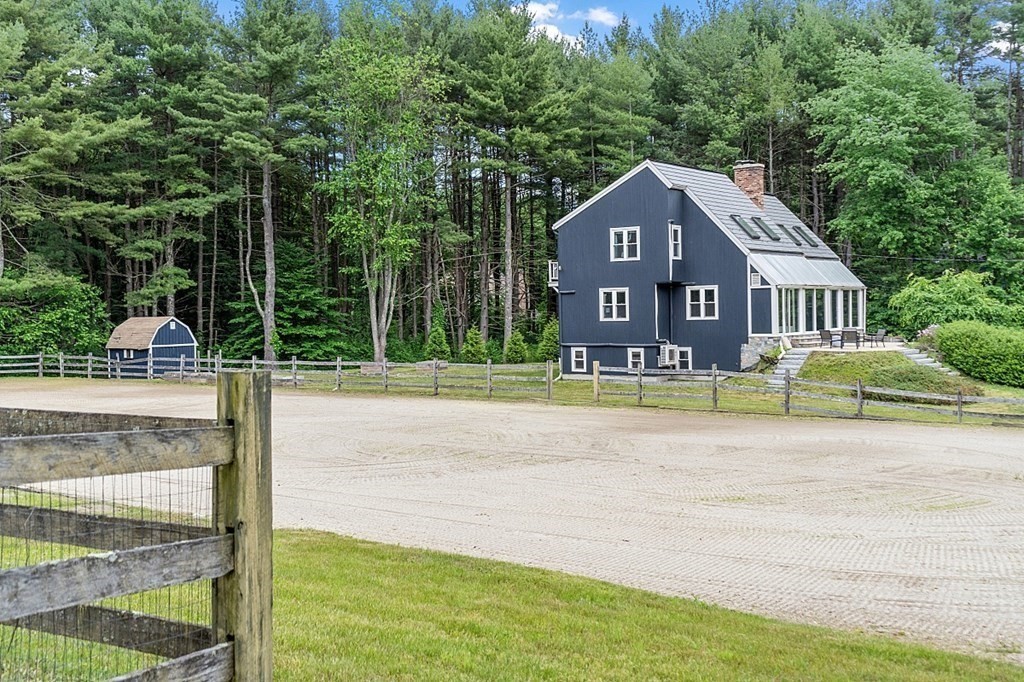 92 Sampson Road Bolton, MA 01740 - Photo 40 of 42 a view of a house with a swimming pool