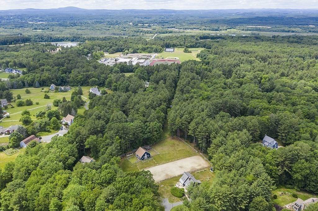 92 Sampson Road Bolton, MA 01740 - Photo 42 of 42 an aerial view of a lush green valley