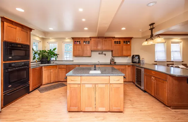 a white toilet sitting next to a bathroom sink