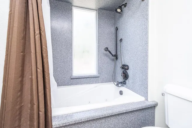 a view of a patio with couches table and chairs and potted plants