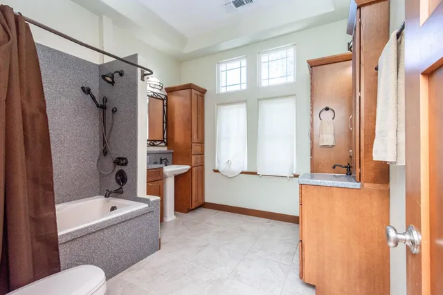 an aerial view of a house with a yard