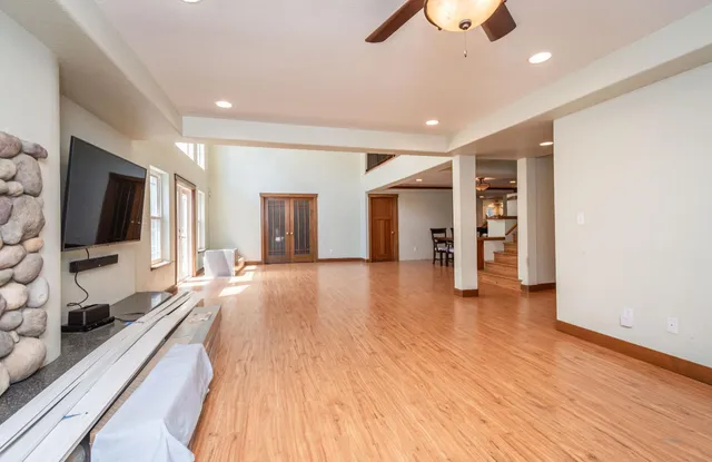a view of livingroom with furniture and workspace