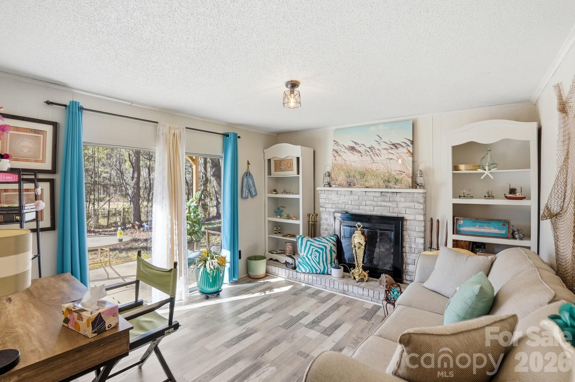 343 Carr Road Dallas, NC 28034 - Photo 11 of 22 a living room with furniture and a fireplace