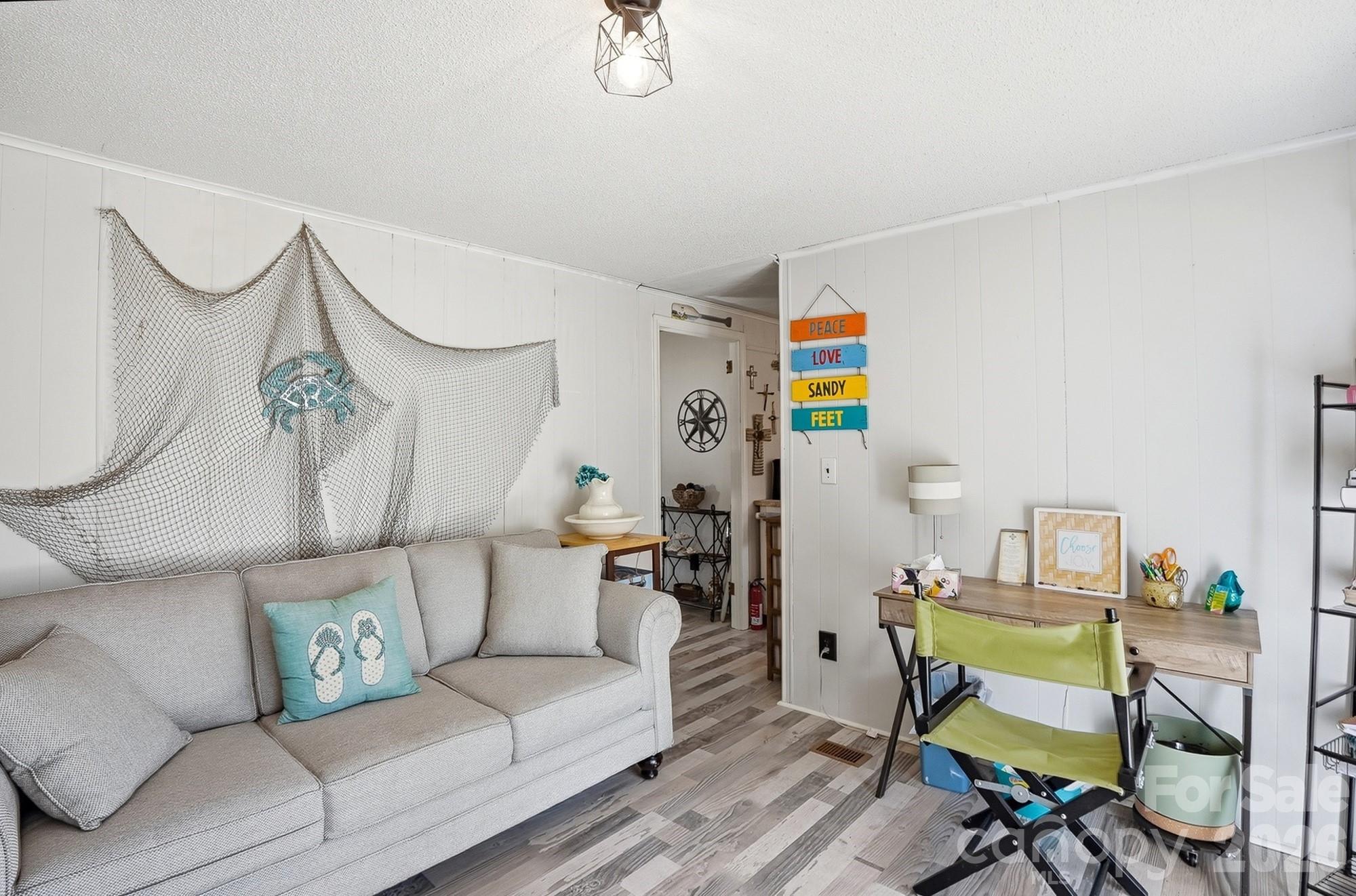 343 Carr Road Dallas, NC 28034 - Photo 12 of 22 a living room with furniture and a wooden floor