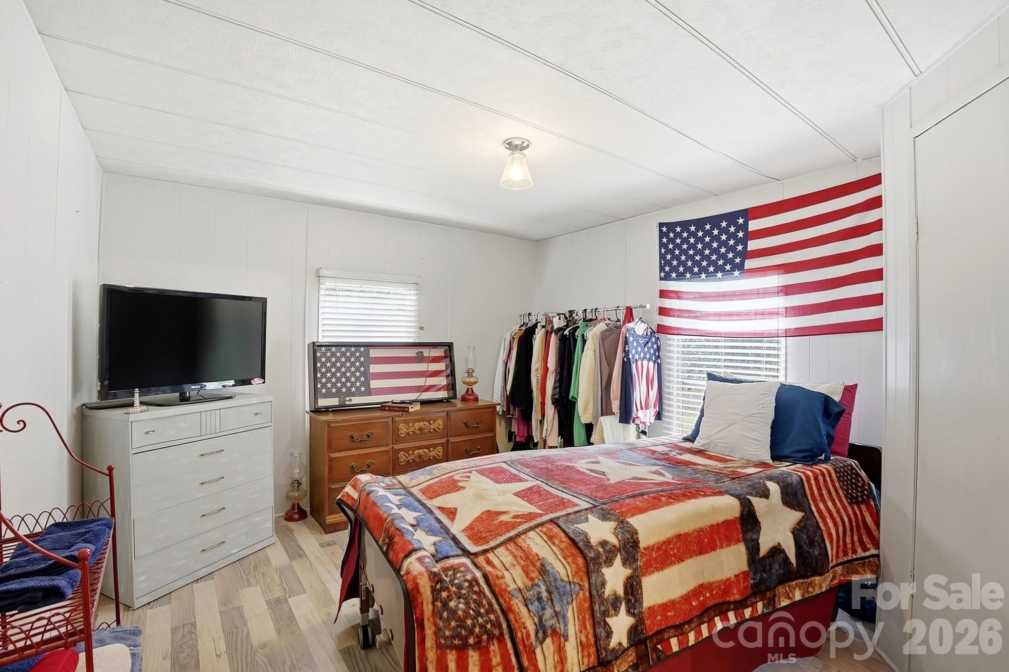 343 Carr Road Dallas, NC 28034 - Photo 13 of 22 a bedroom with a bed and a flat screen tv