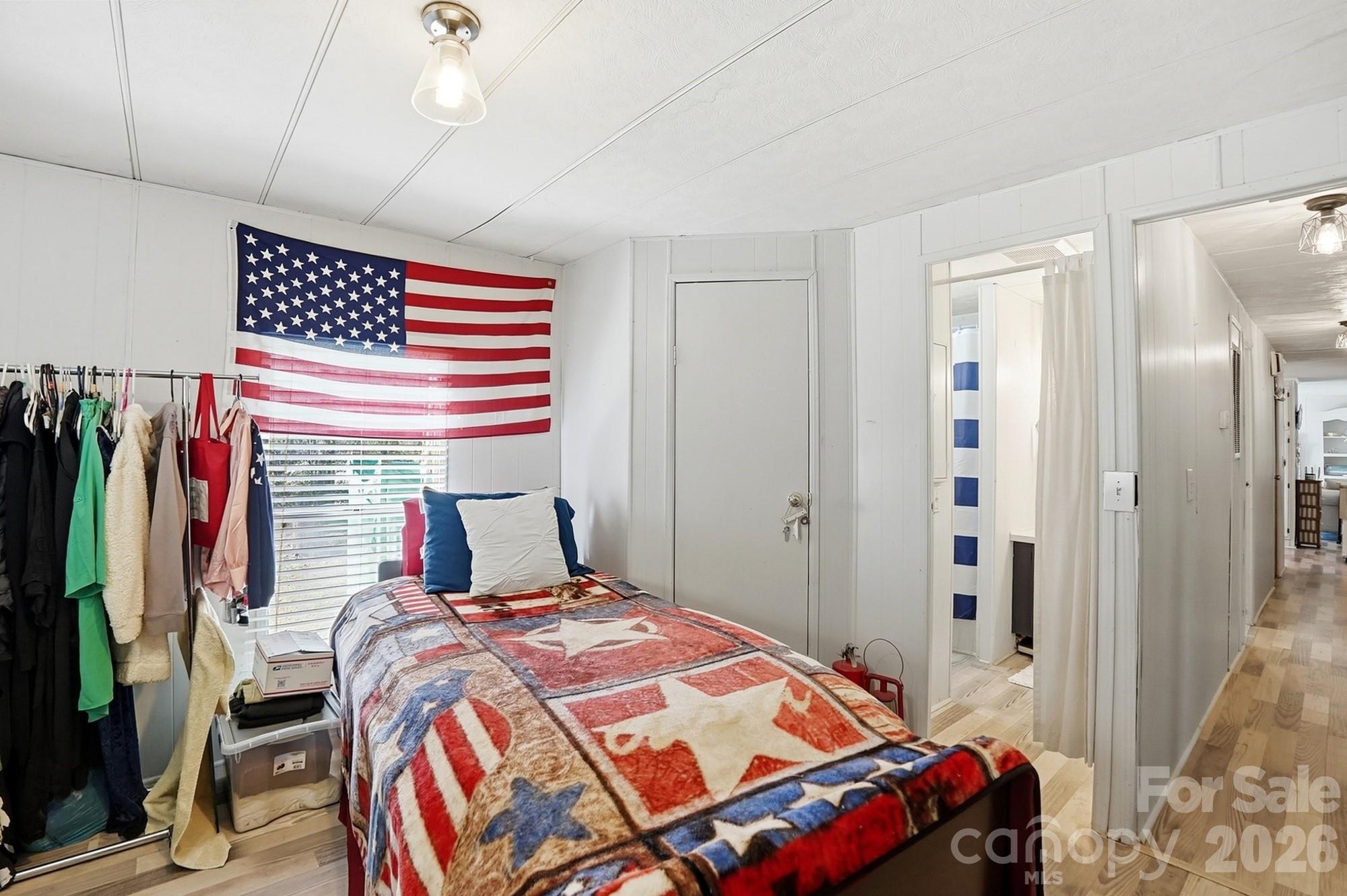 343 Carr Road Dallas, NC 28034 - Photo 14 of 22 a bedroom with a bed and a flat screen tv