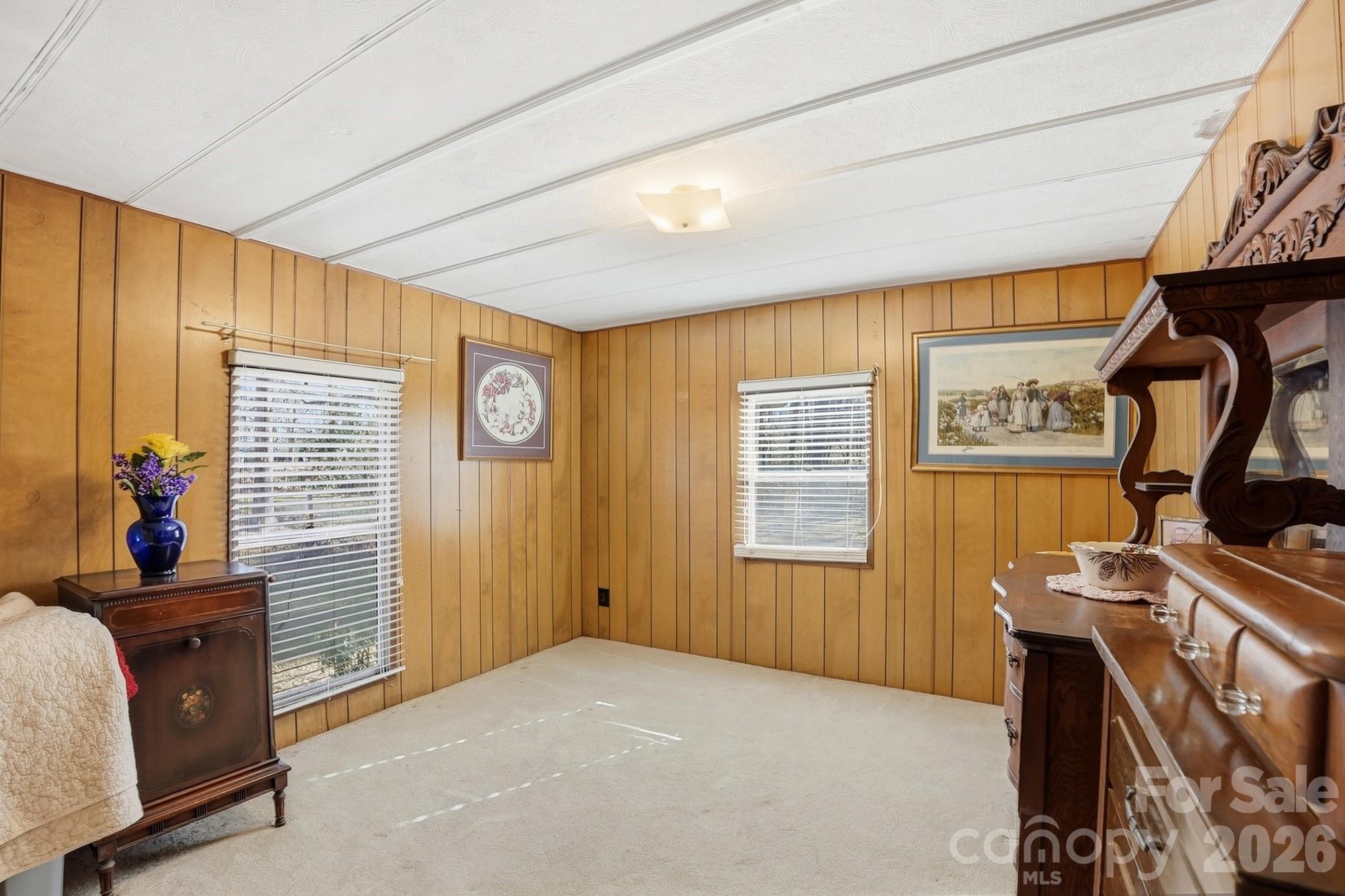 343 Carr Road Dallas, NC 28034 - Photo 18 of 22 a bedroom with a bed and wooden floor