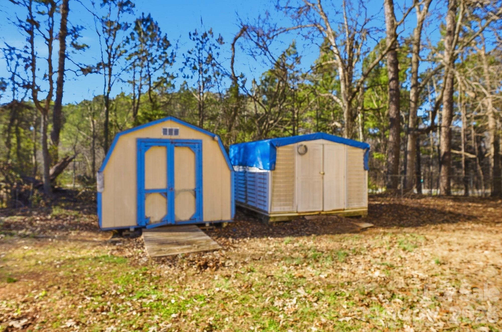 343 Carr Road Dallas, NC 28034 - Photo 21 of 22 a view of a barn with large trees