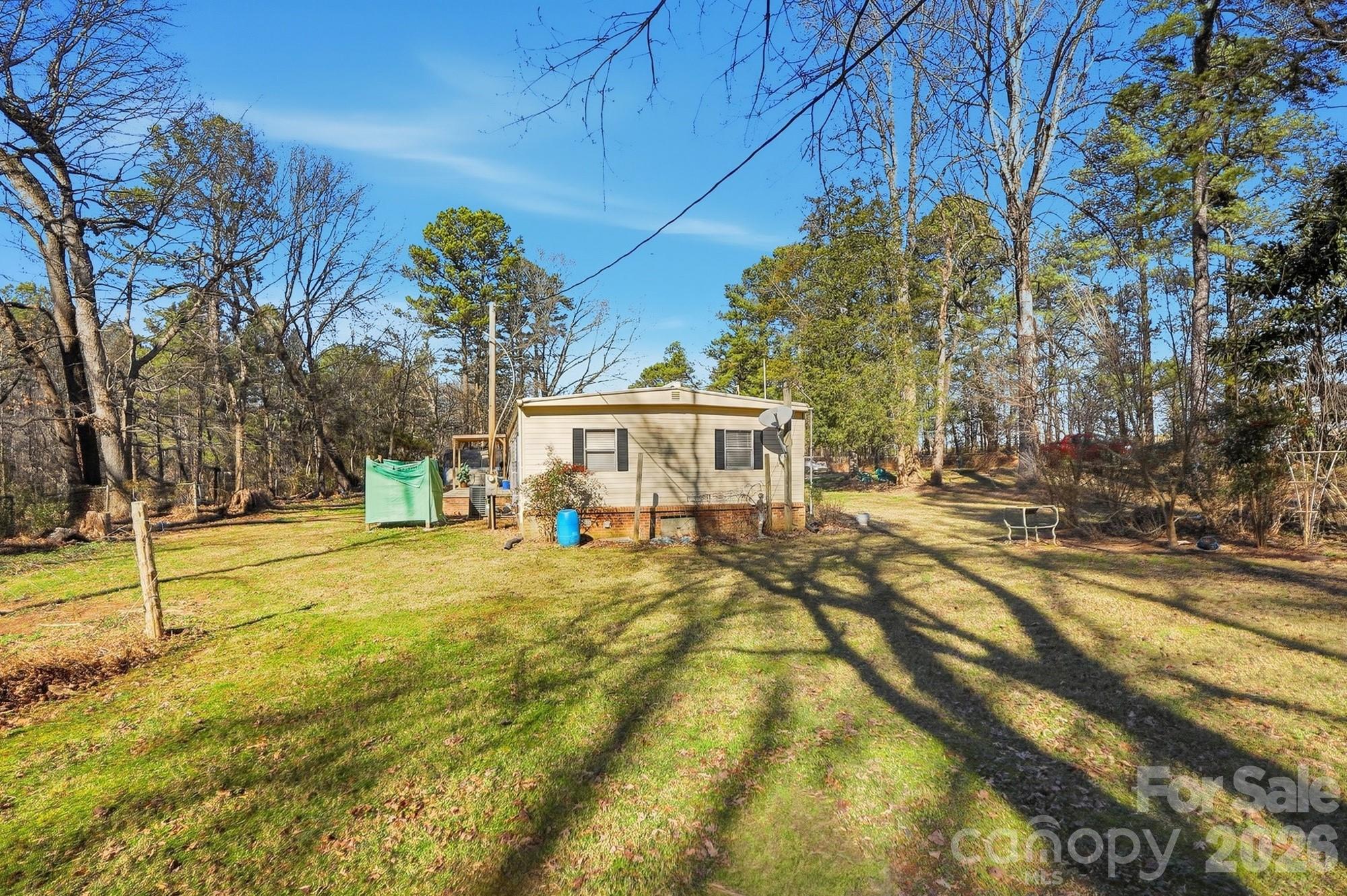 343 Carr Road Dallas, NC 28034 - Photo 22 of 22 a view of a house with swimming pool