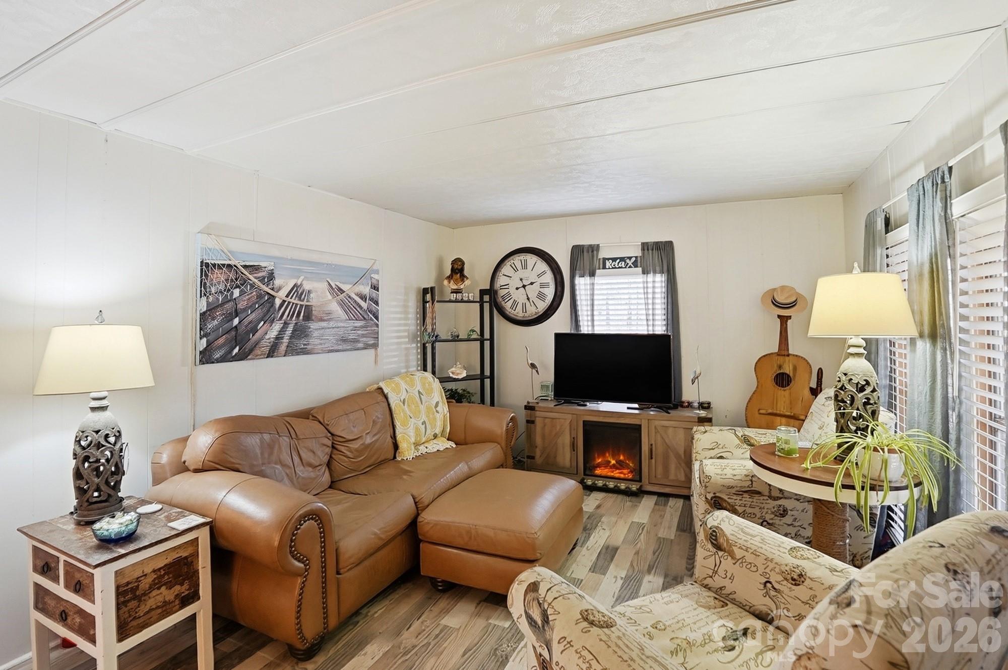 343 Carr Road Dallas, NC 28034 - Photo 4 of 22 a living room with furniture and a flat screen tv