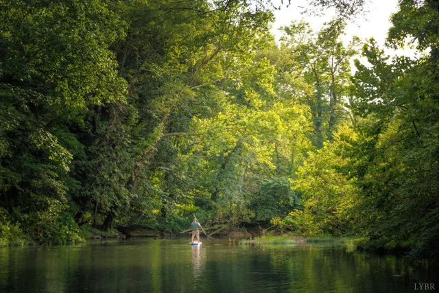 a view of lake with green space