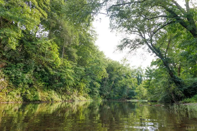 a view of lake with green space