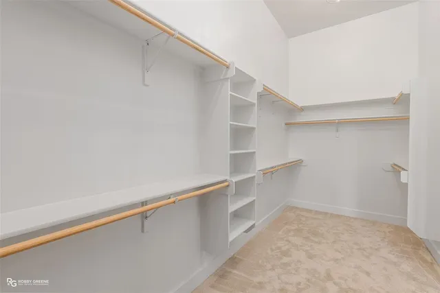 a view of an empty walk in closet